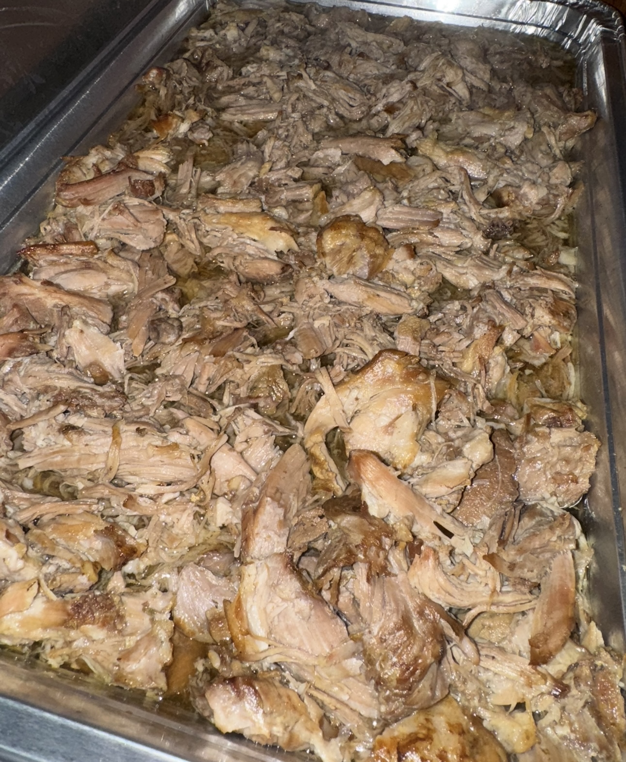 Slow-cooked pulled pork catering tray ready for service