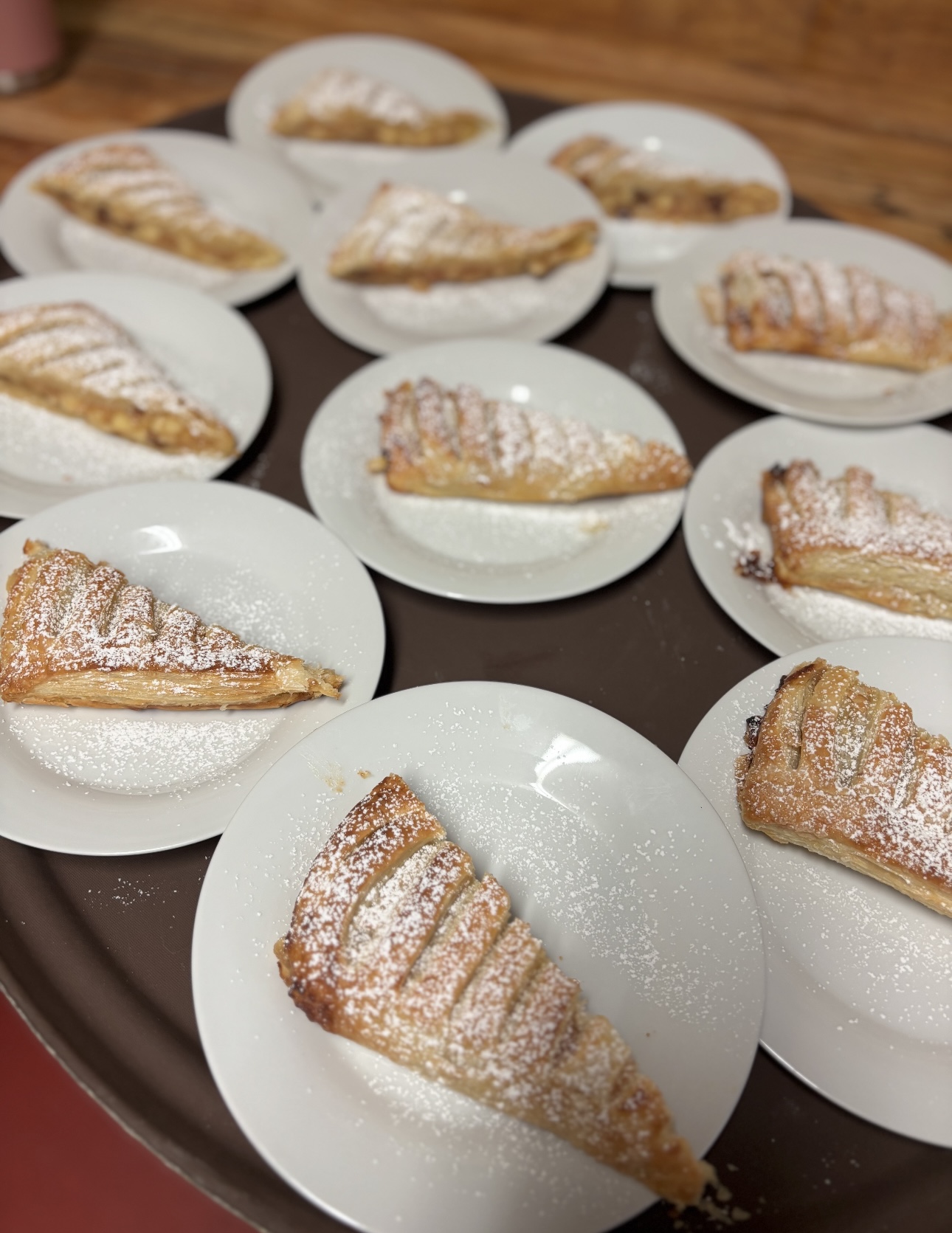 Individually plated apple turnovers dusted with powdered sugar
