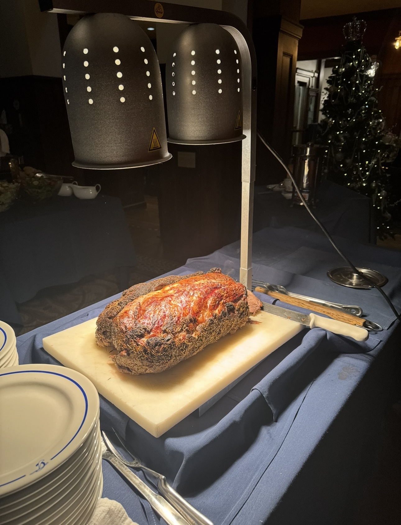 Roast beef carving station under warming lights