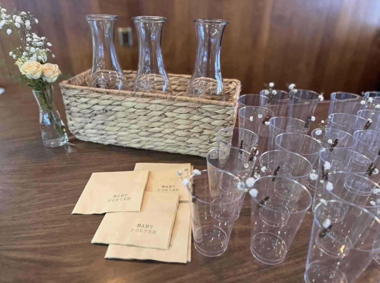 Mimosa bar setup with carafes and Baby Porter napkins