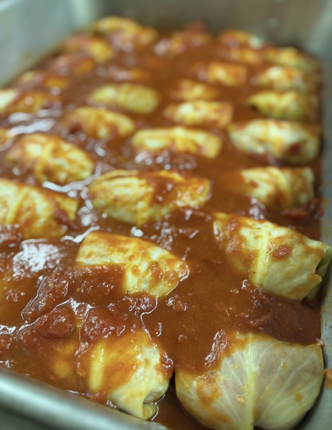 Stuffed cabbage rolls baked in tomato sauce