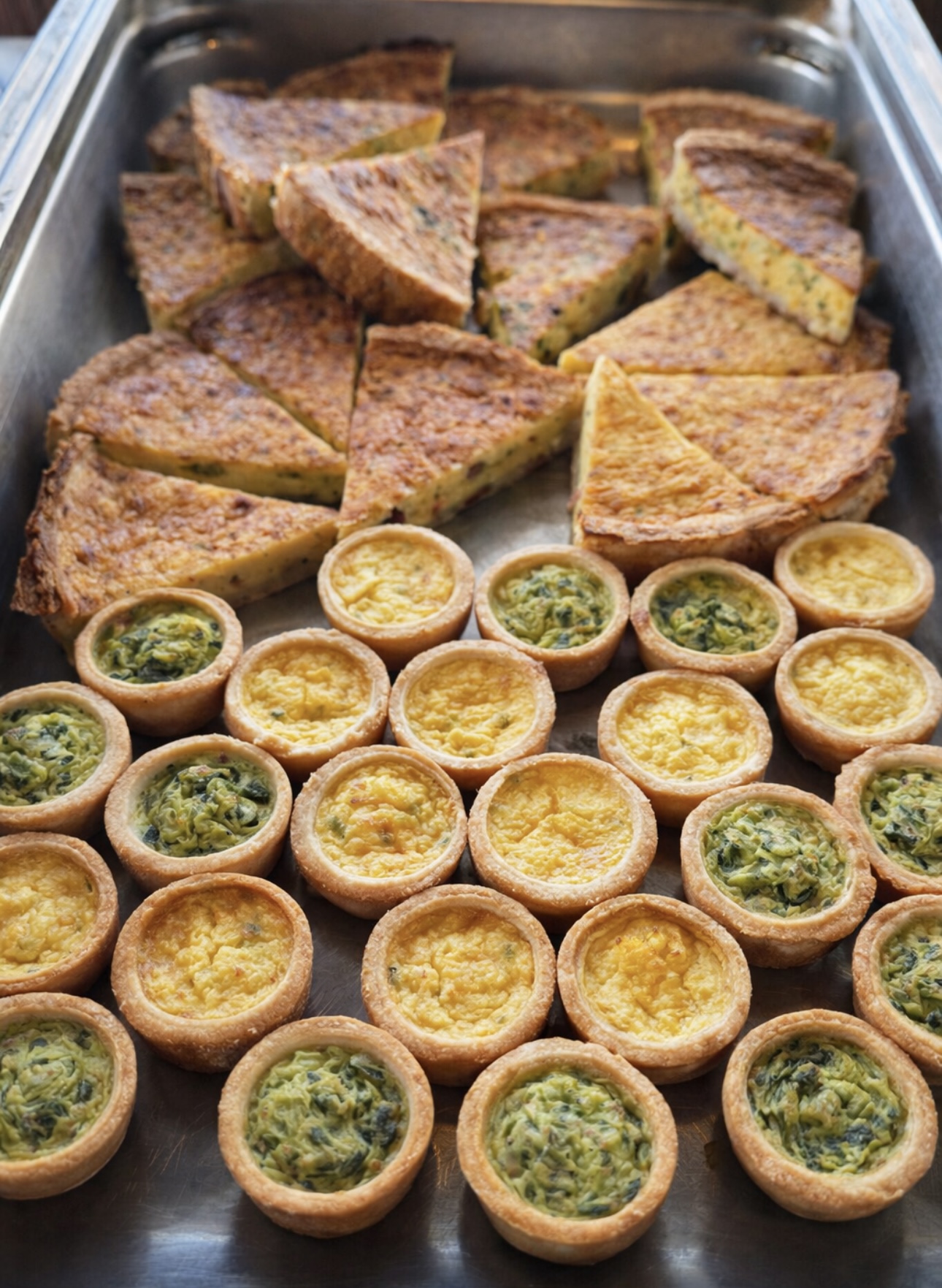 Mini quiches and quiche wedges with spinach and cheese