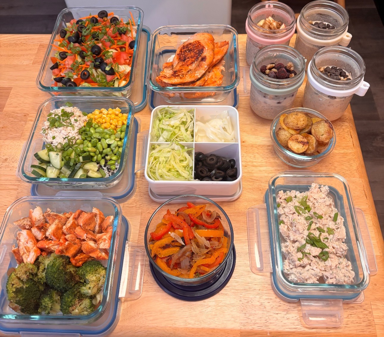 Weekly meal prep spread with proteins, salads, and overnight oats