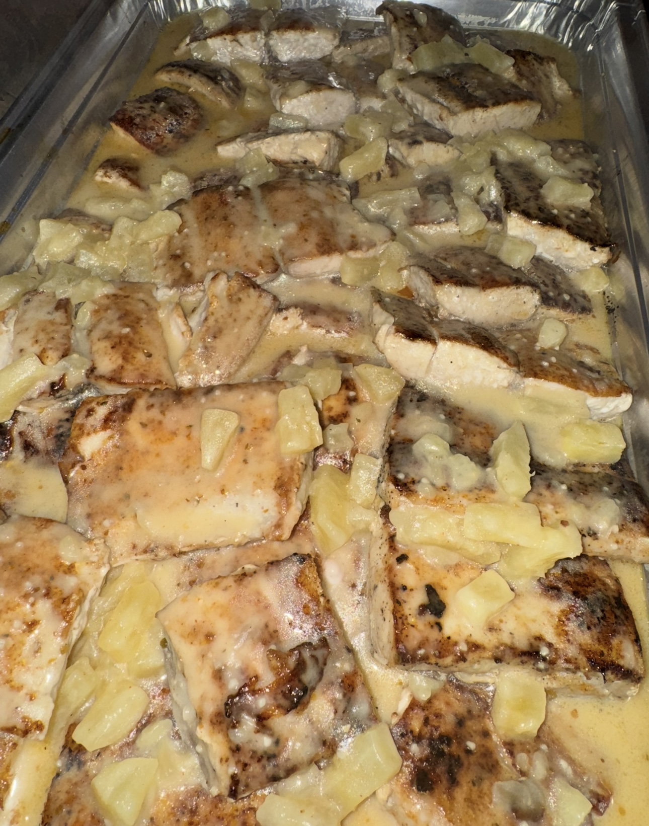 Grilled chicken with pineapple in a creamy pan sauce