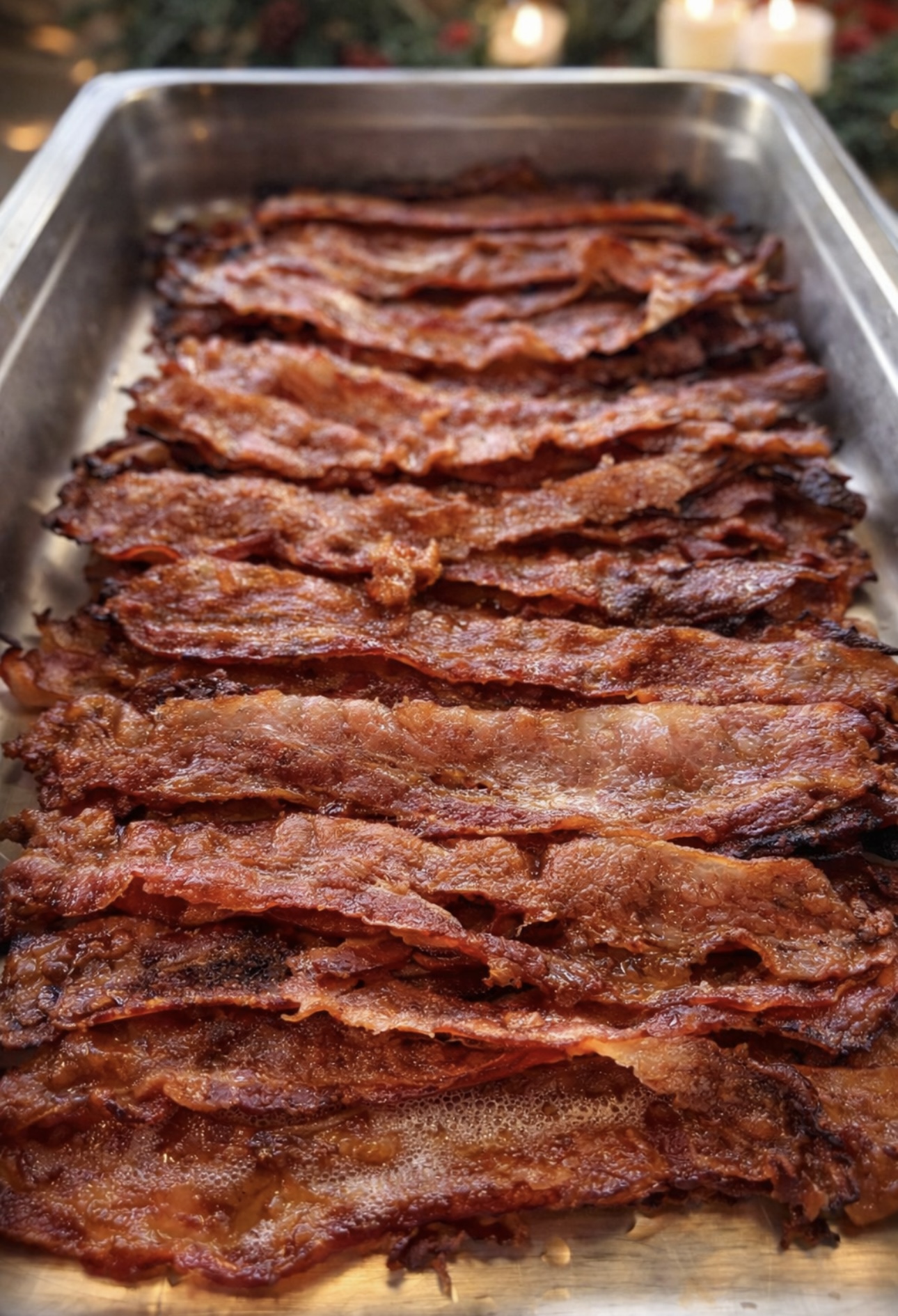 Tray of crispy bacon strips lined up for brunch service