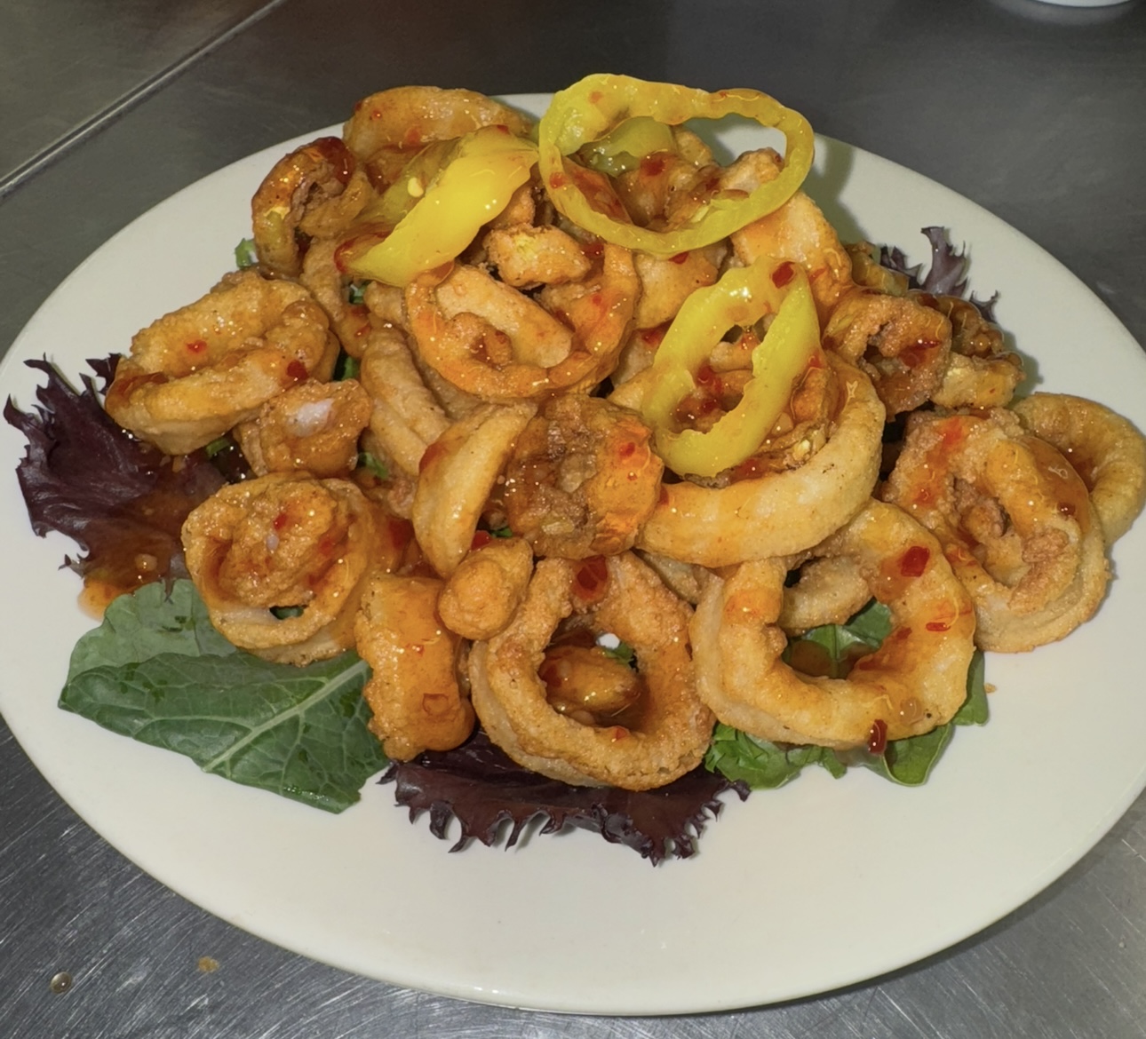 Crispy calamari with sweet chili sauce and banana peppers